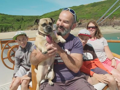 Jamie Goodridge and his family aboard their boat near Watwick Bay on the Milford Haven Waterway